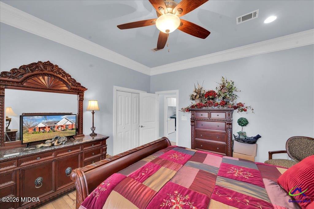 706 Orr Road Fort Valley, GA 31030 - Photo 45 of 50 a bedroom with a bed and a dresser in it