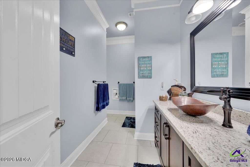 706 Orr Road Fort Valley, GA 31030 - Photo 46 of 50 a bathroom with a granite countertop sink a mirror and shower
