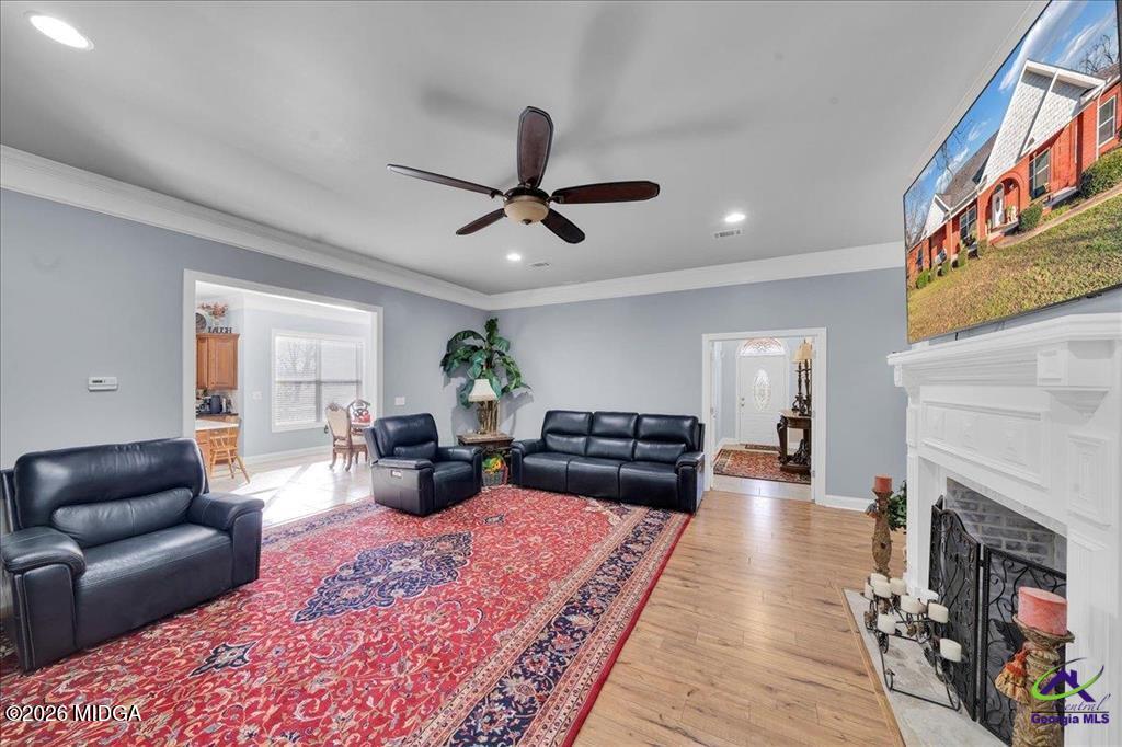 706 Orr Road Fort Valley, GA 31030 - Photo 7 of 50 a living room with furniture and a fireplace