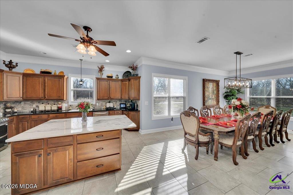 706 Orr Road Fort Valley, GA 31030 - Photo 10 of 50 a view of a dining room and chairs in a room