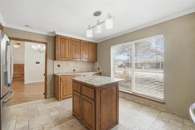 a kitchen with a stove and a sink