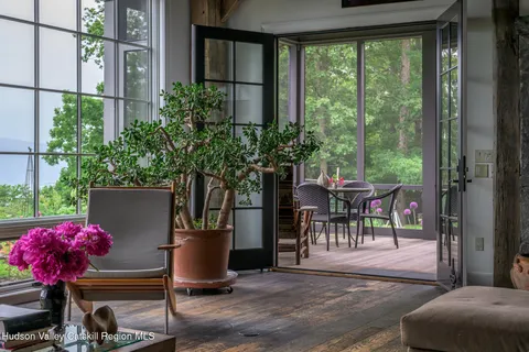 a view of a backyard with sitting area