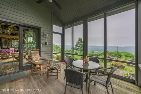 a view of a flower garden in front of a house