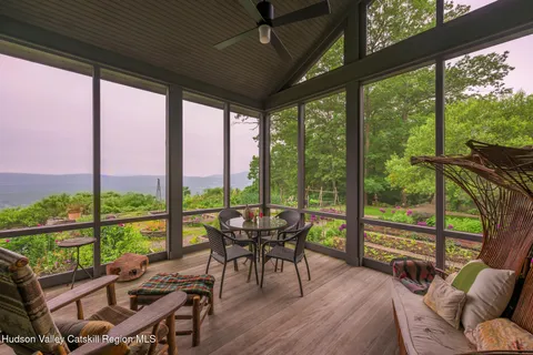a view of a brick house with a yard