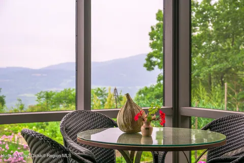 a view of a balcony with wooden floor and outdoor space