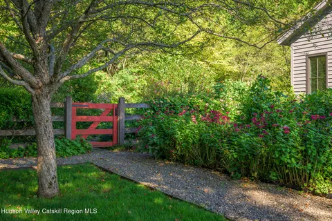 a view of a city from a balcony with furniture