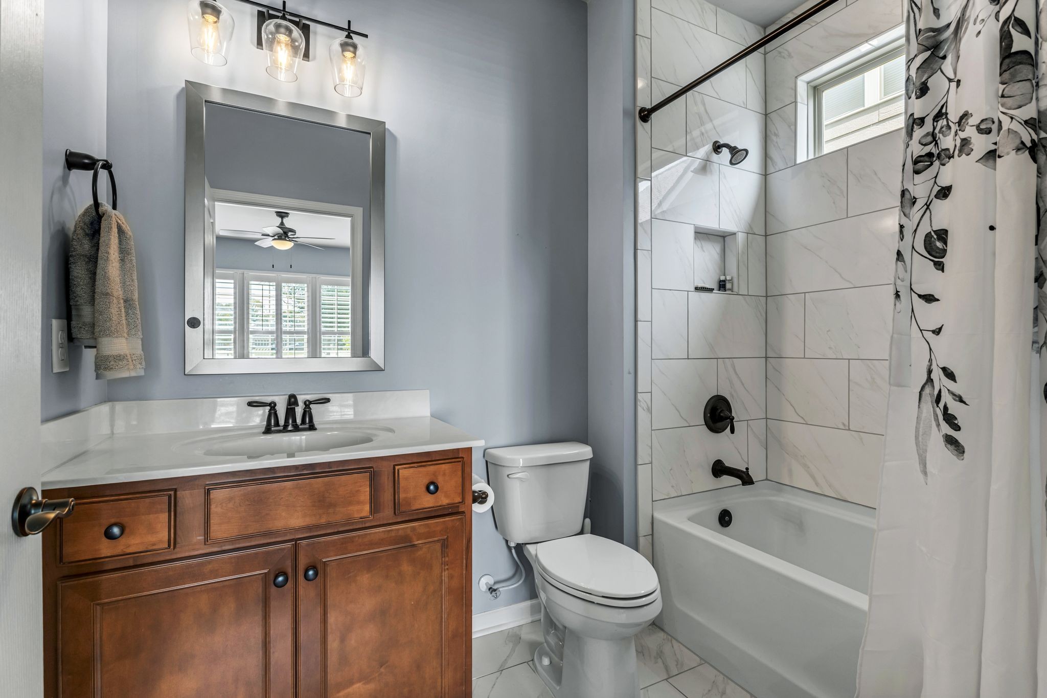 1121 Davidson Walk Spring Hill, TN 37174 - Photo 21 of 27 a bathroom with a sink a toilet and a bathtub