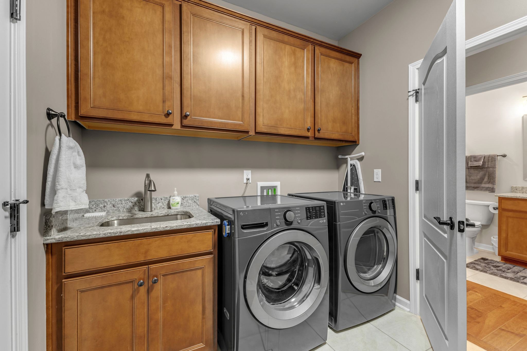 1121 Davidson Walk Spring Hill, TN 37174 - Photo 23 of 27 a utility room with sink dryer and washer