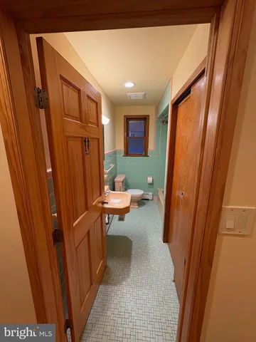 a living room with a furniture and a window