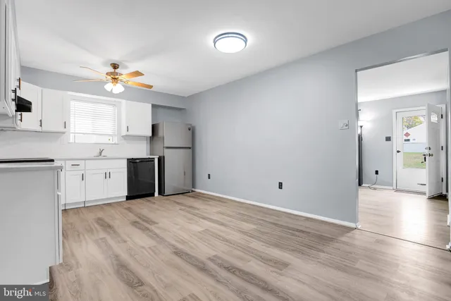 a kitchen with stainless steel appliances cabinets a sink and a stove