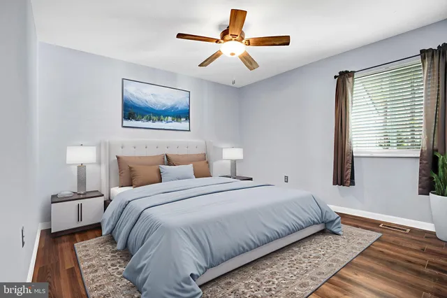 a bedroom with bed and window