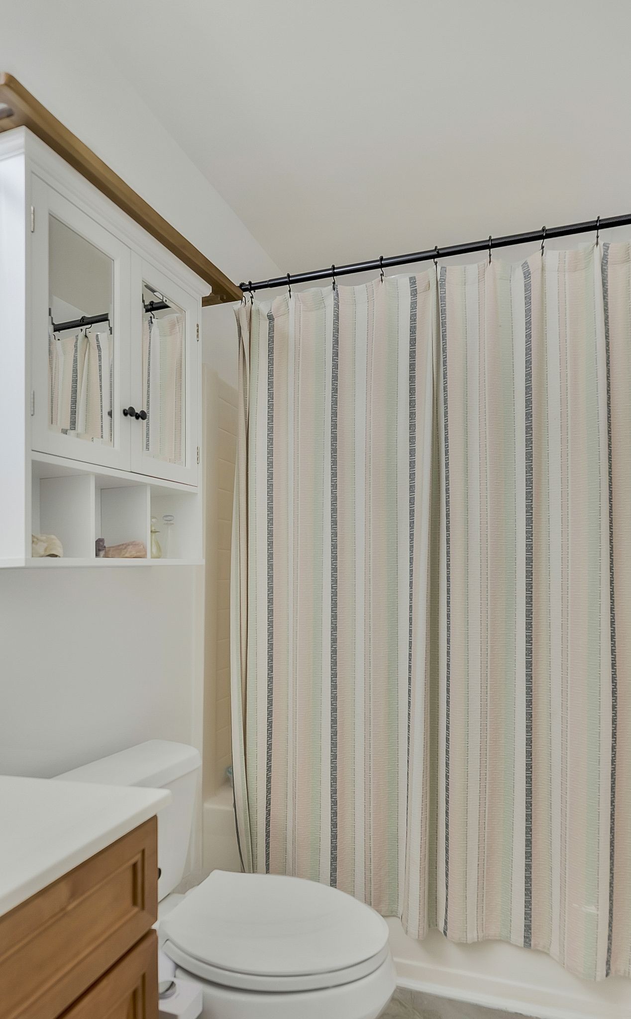 3208 Calvin Court Franklin, TN 37064 - Photo 13 of 26 a bathroom with a toilet a sink and curtain