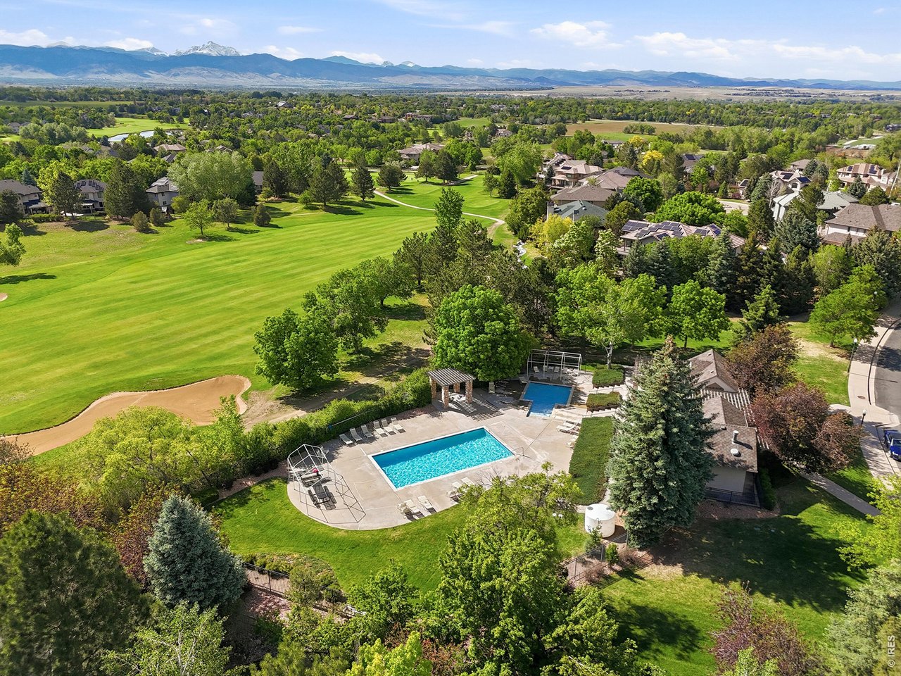547 Sawtooth Point Lafayette, CO 80026 - Photo 40 of 44 Community pool just across the street from the home. (That's the 7th hole of the golf course)