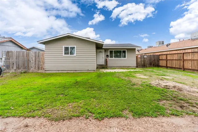 a house with garden in front of it