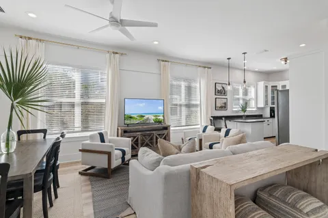 a living room with fireplace furniture and a flat screen tv
