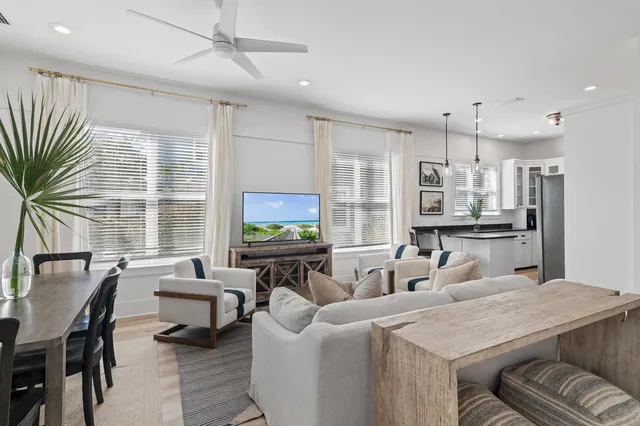 a living room with fireplace furniture and a flat screen tv