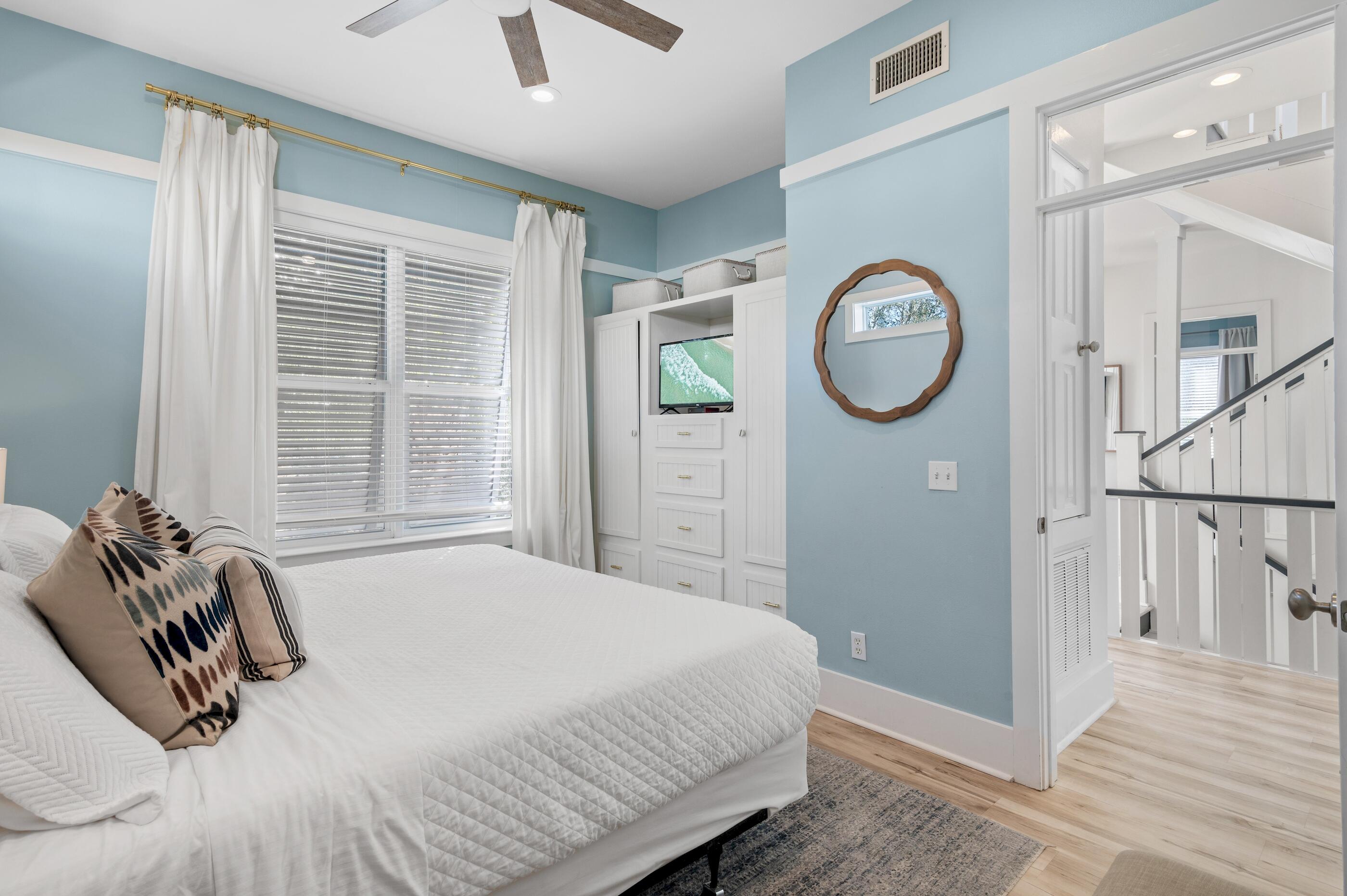 348 Lakewood Drive Santa Rosa Beach, FL 32459 - Photo 24 of 46 a bedroom with a bed a clock and a window