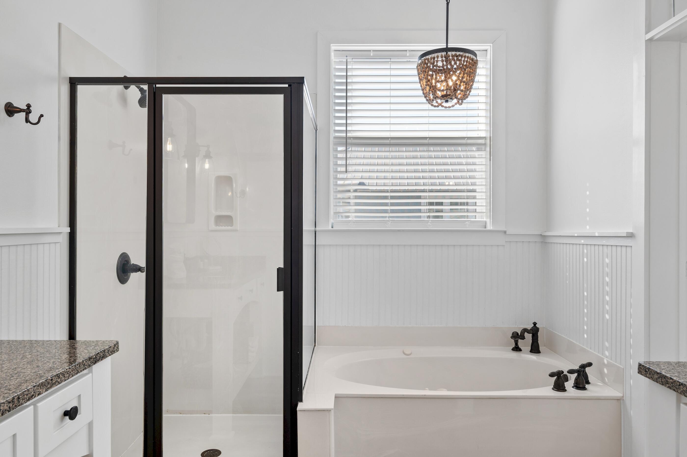 348 Lakewood Drive Santa Rosa Beach, FL 32459 - Photo 30 of 46 a bathroom with a granite countertop sink a mirror and shower