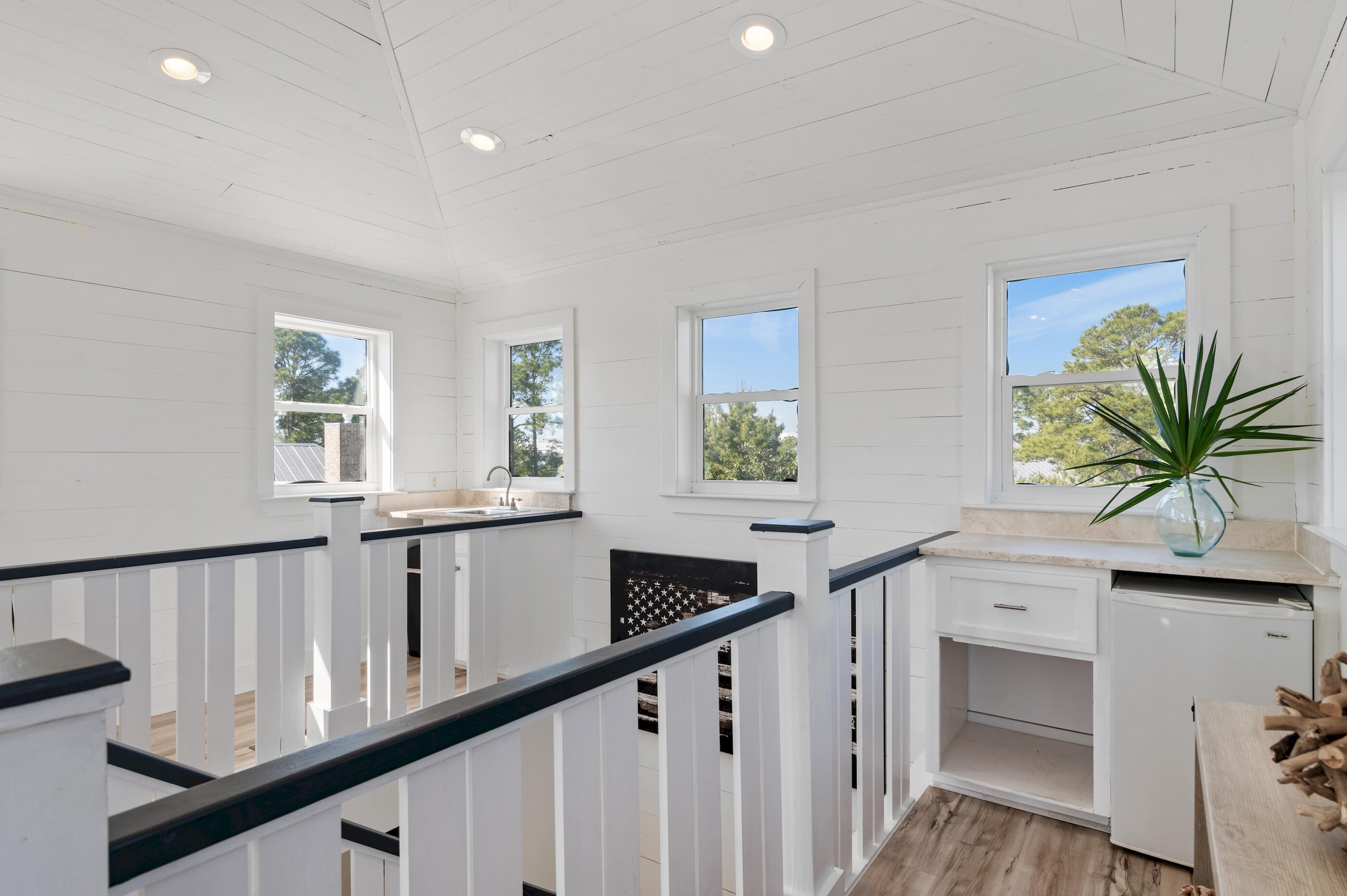 348 Lakewood Drive Santa Rosa Beach, FL 32459 - Photo 31 of 46 a view of entryway and hall with wooden floor