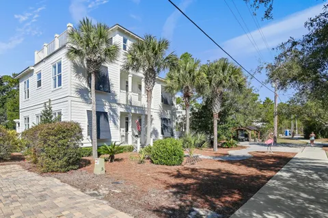 a view of a street with a building in the background