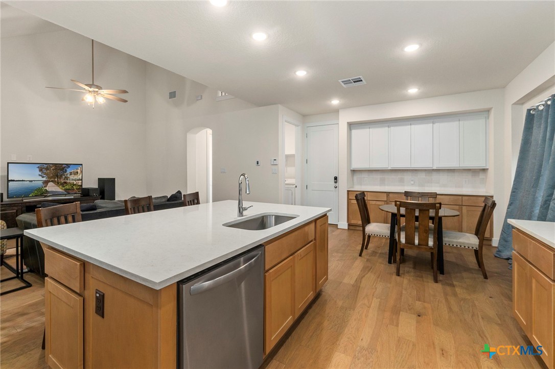 1845 Nettletree Road New Braunfels, TX 78132 - Photo 15 of 33 a large kitchen with a table and chairs