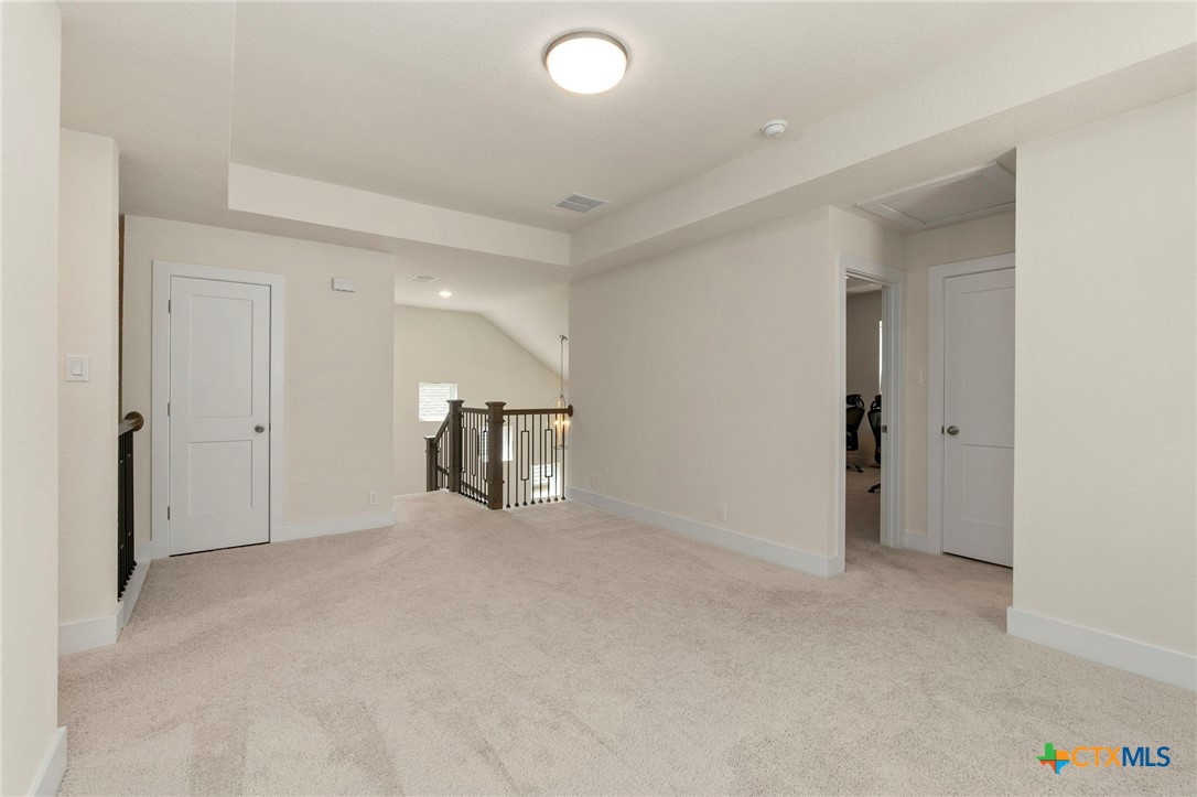 1845 Nettletree Road New Braunfels, TX 78132 - Photo 23 of 33 an empty room with chandelier fan