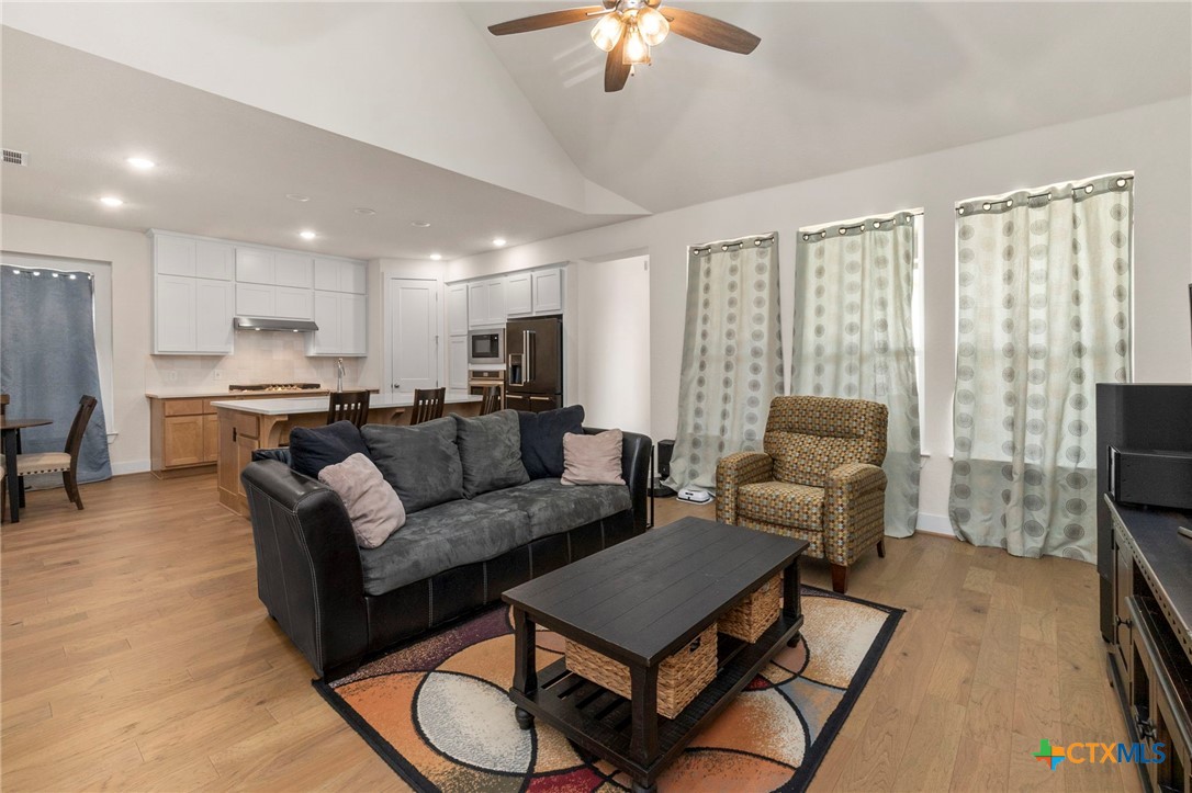 1845 Nettletree Road New Braunfels, TX 78132 - Photo 6 of 33 a living room with furniture and a flat screen tv