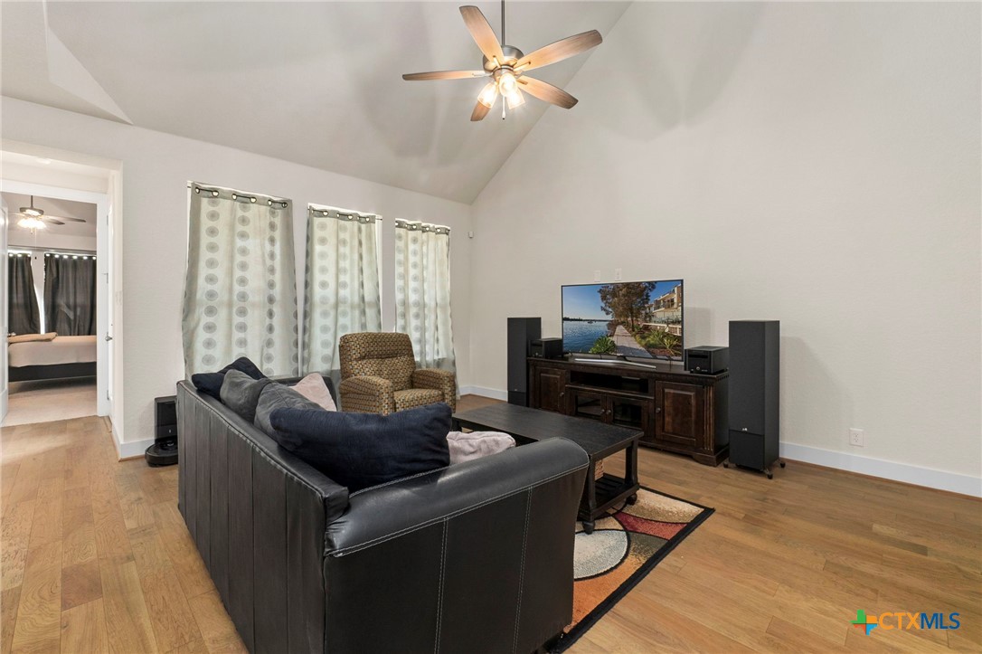 1845 Nettletree Road New Braunfels, TX 78132 - Photo 7 of 33 a living room with furniture and a flat screen tv