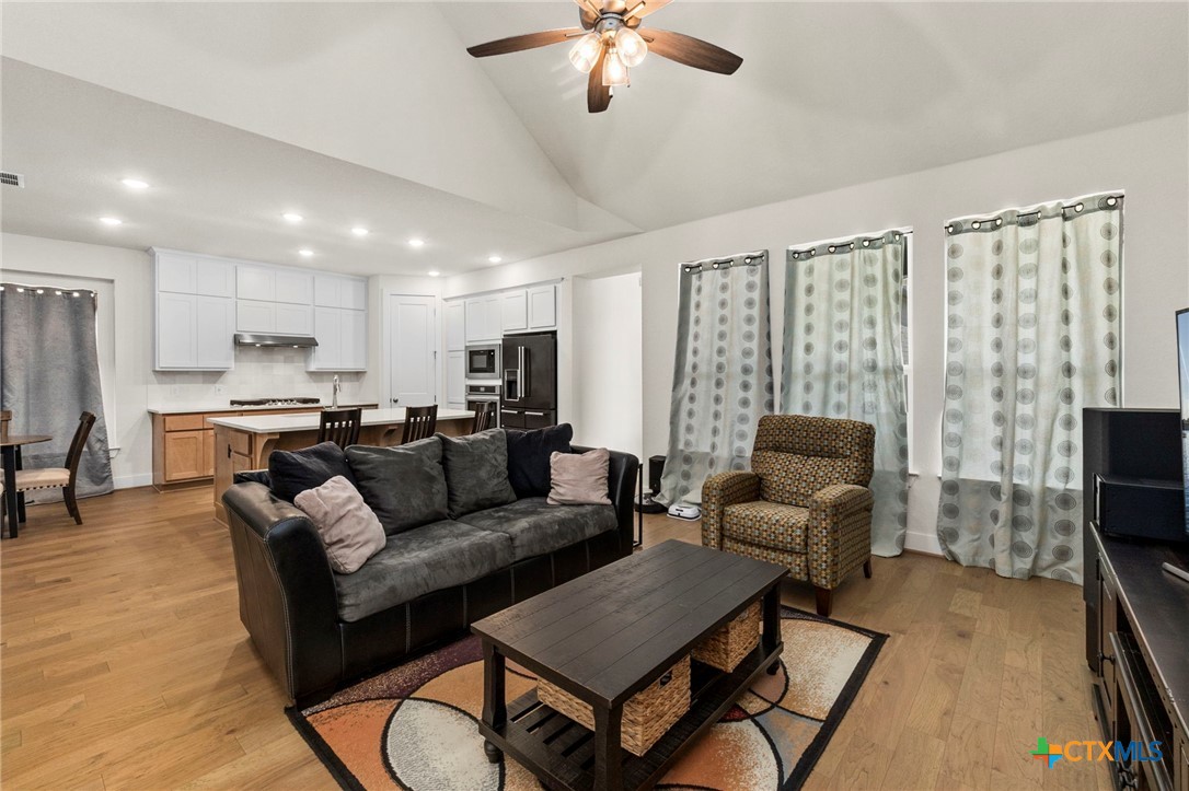 1845 Nettletree Road New Braunfels, TX 78132 - Photo 10 of 33 a living room with furniture and a flat screen tv