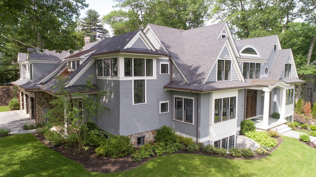 65 White Oak Road Wellesley, MA 02481 - Photo 27 of 28 a view of a white house with a yard plants and large tree