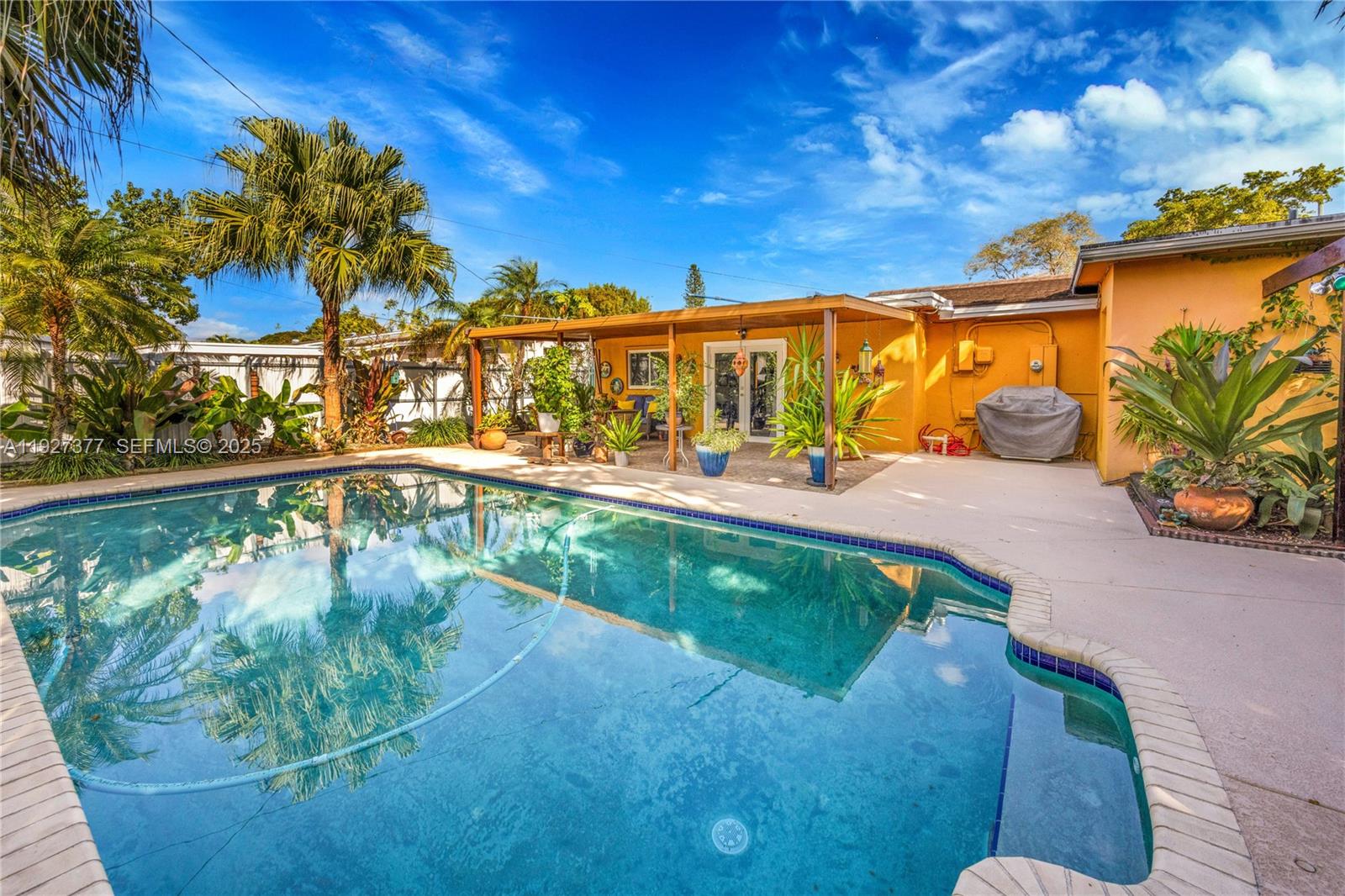 4110 West 7th Lane Hialeah, FL 33012 - Photo 13 of 24 a view of a swimming pool with a patio