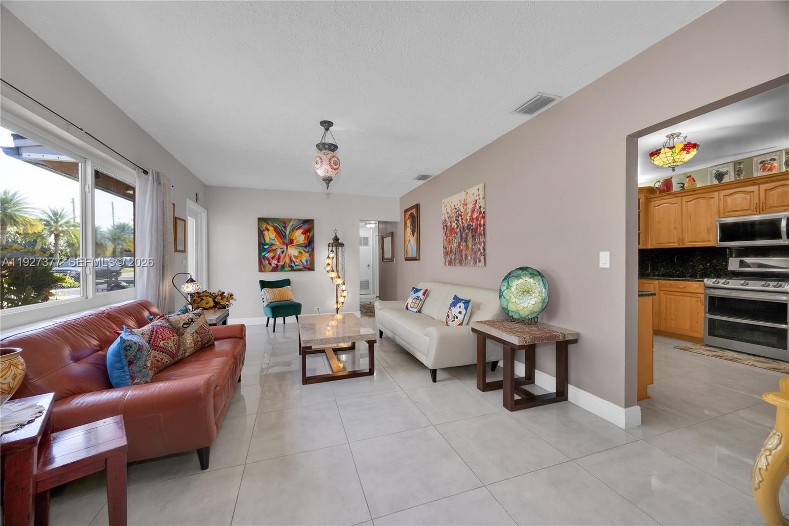 4110 West 7th Lane Hialeah, FL 33012 - Photo 20 of 22 a living room with furniture and a window
