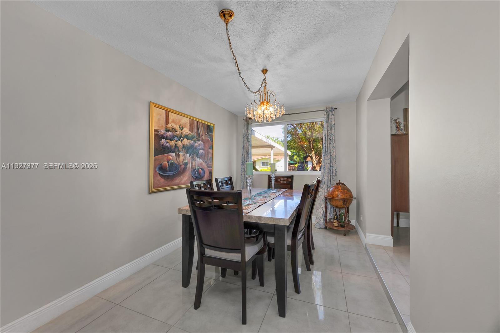 4110 West 7th Lane Hialeah, FL 33012 - Photo 10 of 22 a view of a dining room with furniture window and outside view