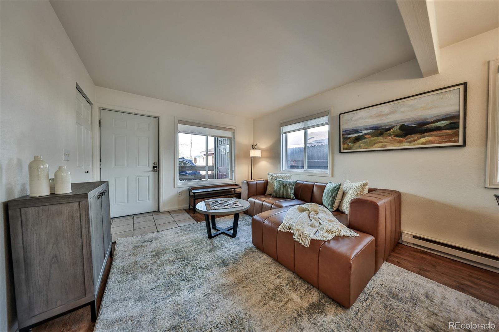 233 Fraser Avenue, Unit R1 Fraser, CO 80442 - Photo 9 of 23 a living room with furniture and wooden floor