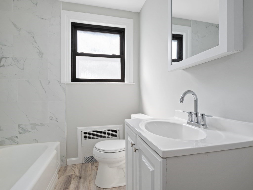 48 Albert Street Waltham, MA 02453 - Photo 13 of 37 a bathroom with a sink and a toilet