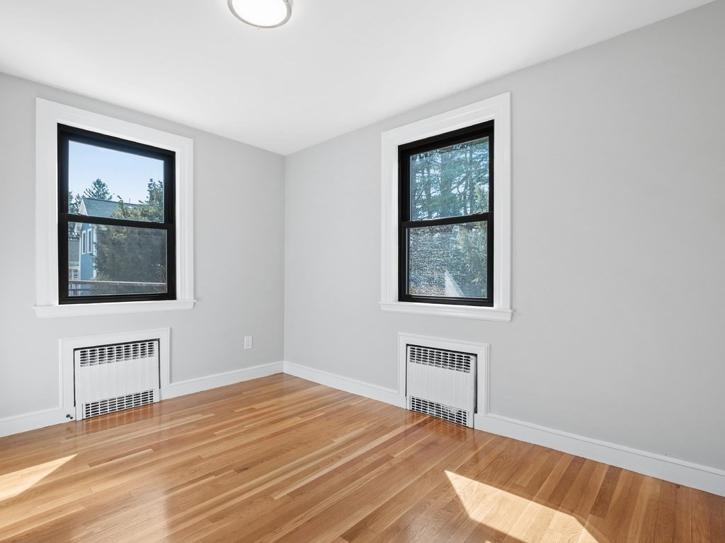 48 Albert Street Waltham, MA 02453 - Photo 14 of 37 a view of an empty room with a window