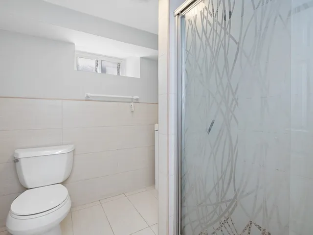 a view of a storage and utility room with cabinets