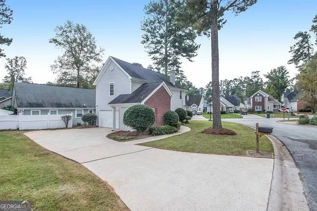 a front view of a house with garden
