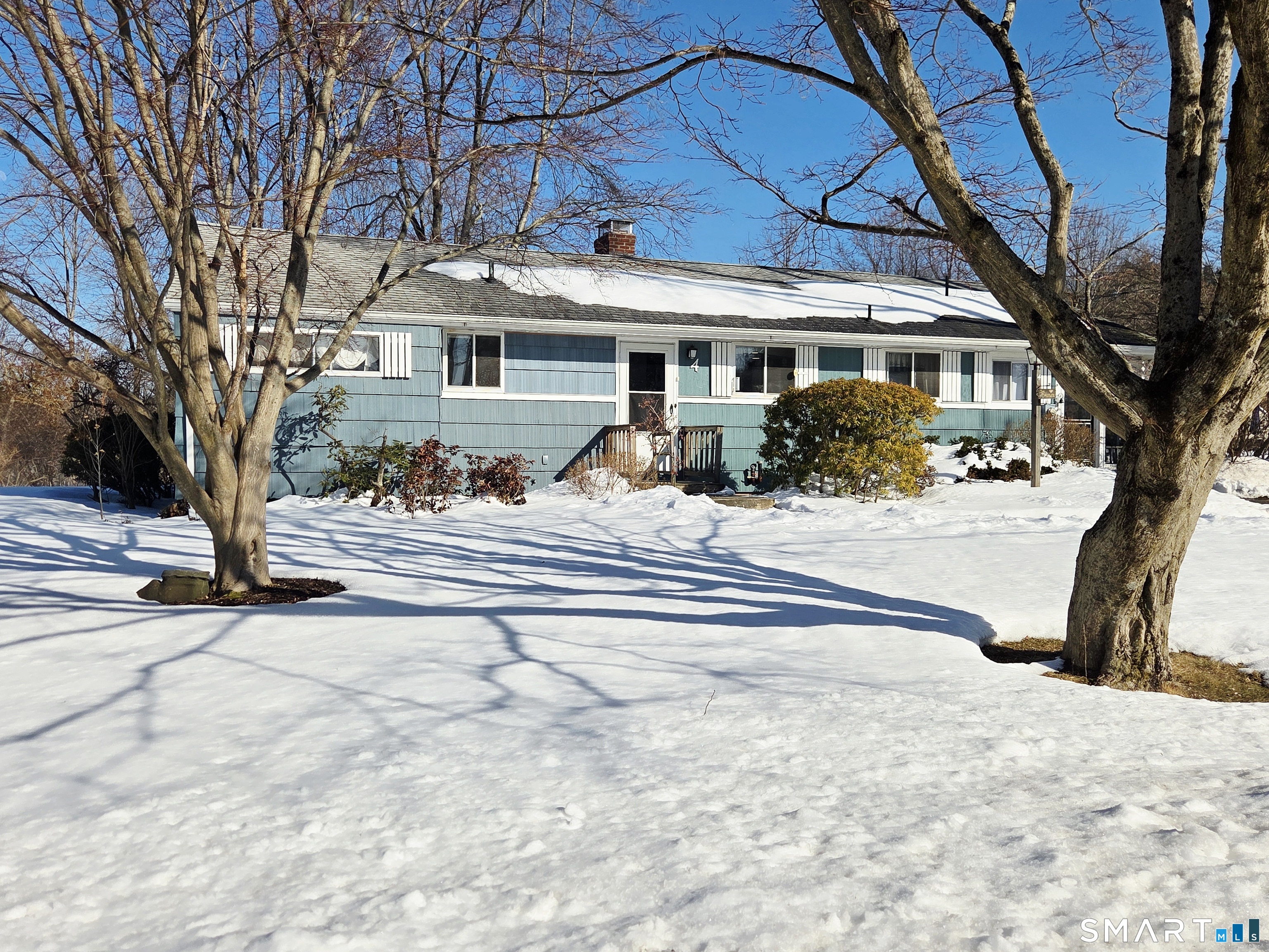 4 Lewis Street Simsbury, CT 06081 - Photo 1 of 30 a front view of a house with a large trees