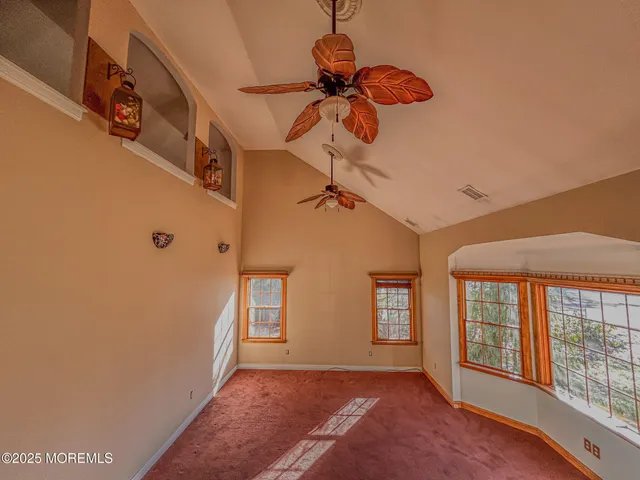 a view of entryway with wooden floor and stairs