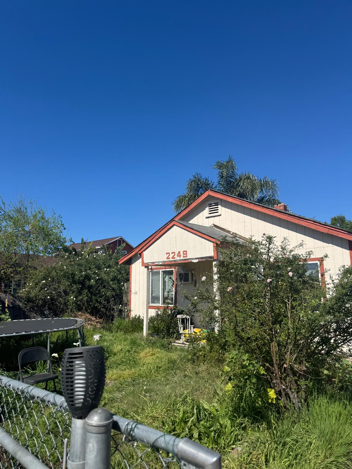 2249 East Vine Street Stockton, CA 95205 - Photo 1 of 8 a front view of a house with garden