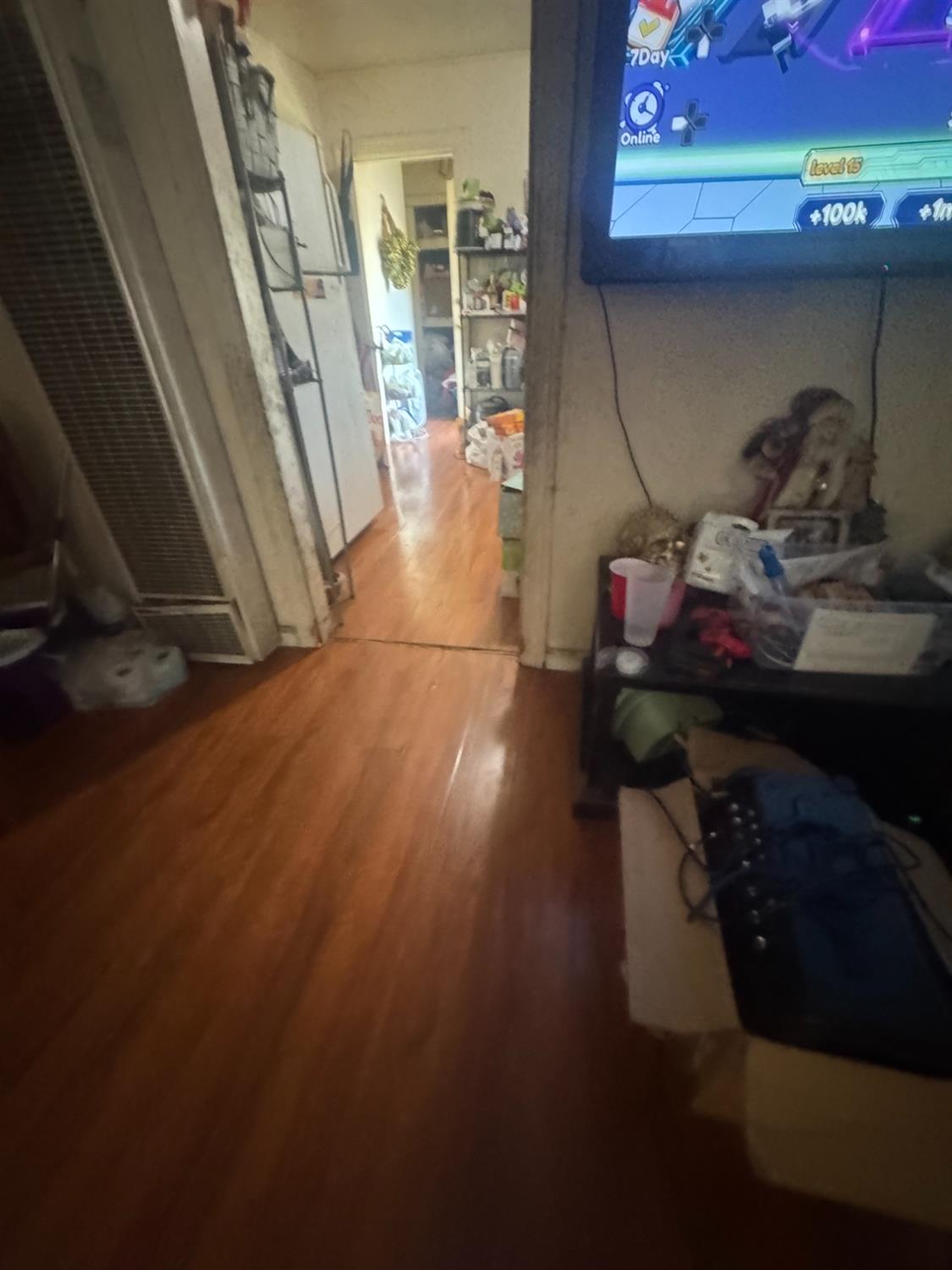 2249 East Vine Street Stockton, CA 95205 - Photo 2 of 8 a room with water heater and wooden floor