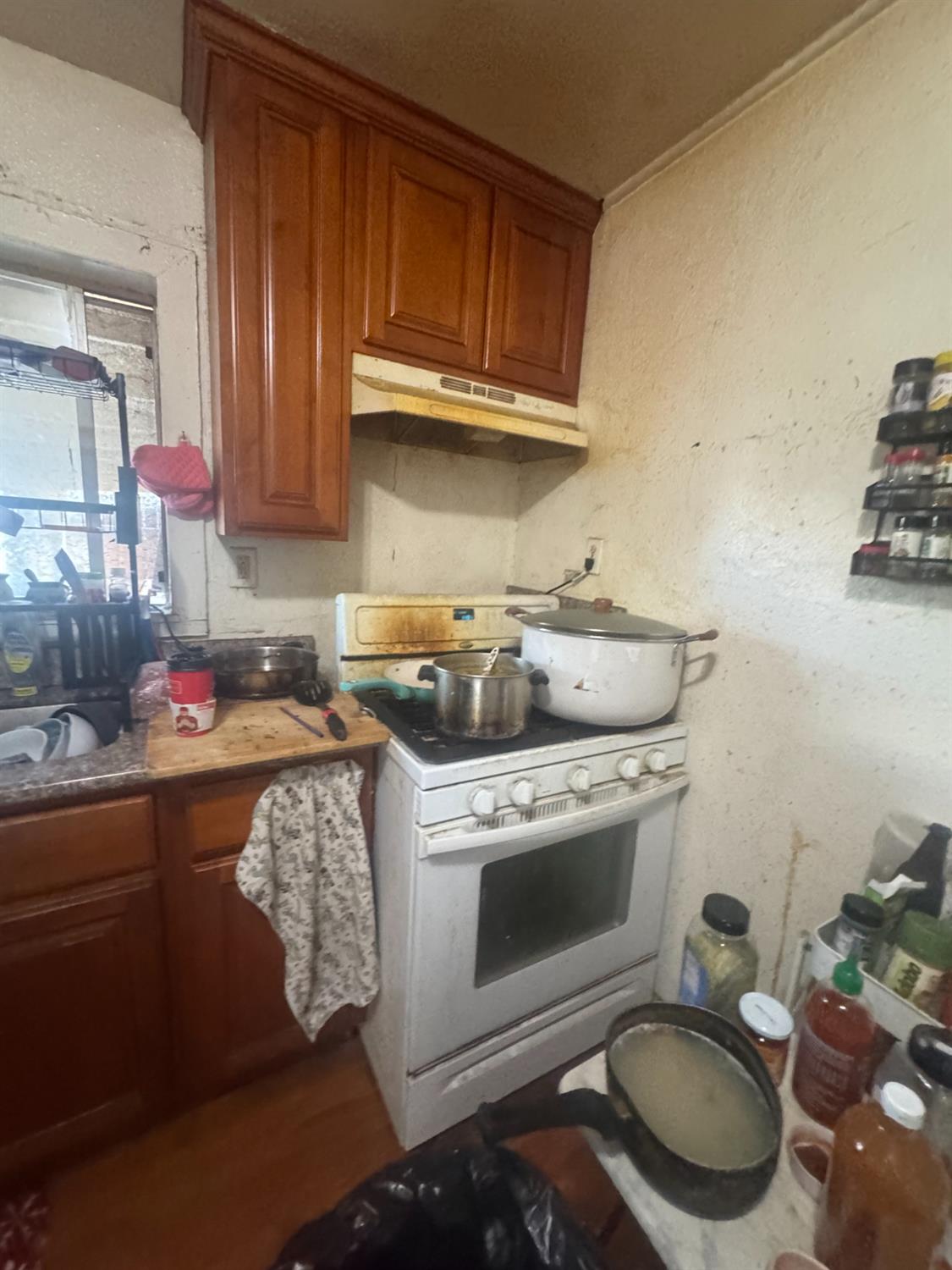 2249 East Vine Street Stockton, CA 95205 - Photo 3 of 8 a kitchen with a stove and a sink