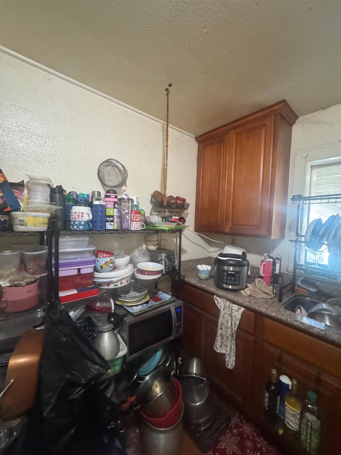 2249 East Vine Street Stockton, CA 95205 - Photo 4 of 8 a kitchen with sink a stove and cabinets