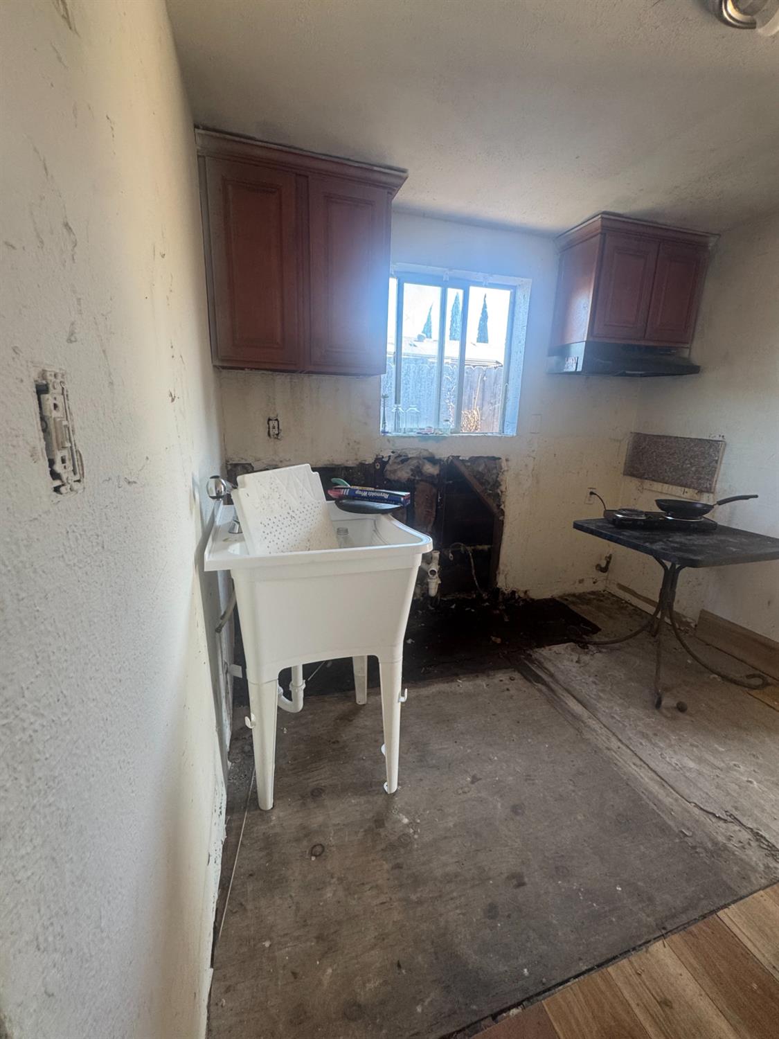2249 East Vine Street Stockton, CA 95205 - Photo 7 of 8 a view of a workspace with furniture and a window