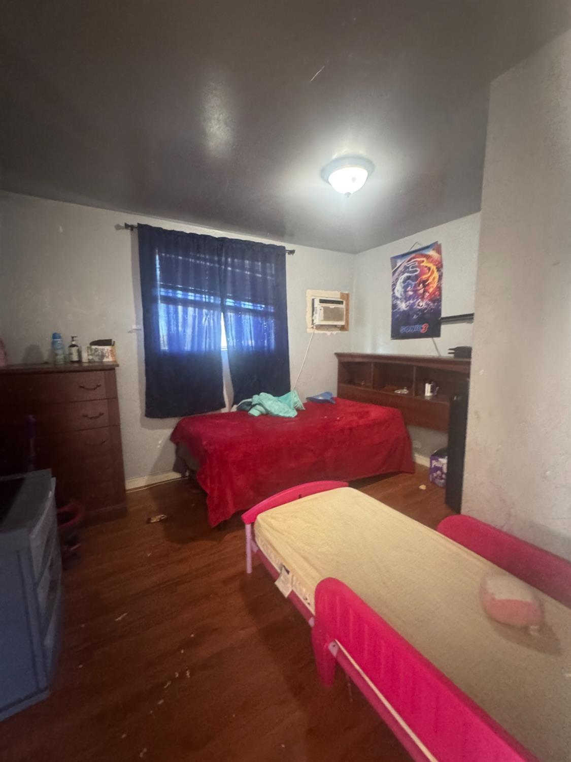 2249 East Vine Street Stockton, CA 95205 - Photo 8 of 8 a bedroom with a bed and window