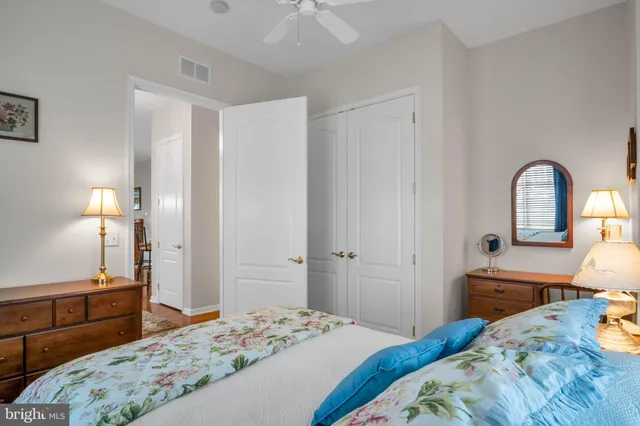 a bedroom with a bed and a dresser in it