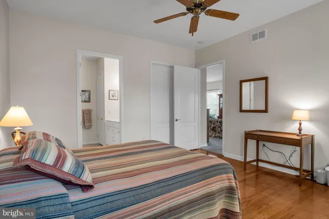a bedroom with a bed and a lamp on table