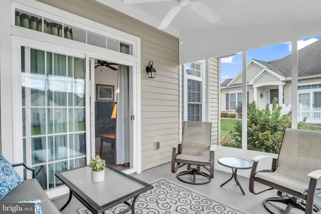 a view of a patio with couple of chairs and a table