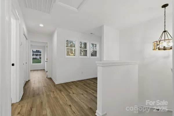 a view of livingroom with hardwood floor and hallway